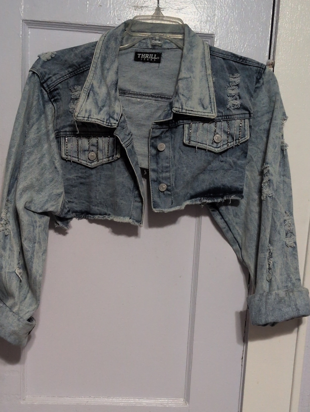 Thrill Cropped Distressed Denim Jacket in Light Blue Wash
